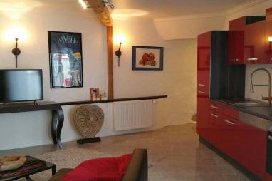 kitchen with living area and flat screen TV